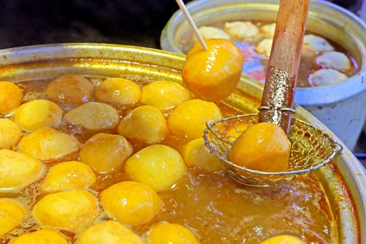 The yellow cooked curry fishball fast food in Hong Kong street