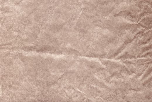 The Brown blank crumpled and grungy textured paper background