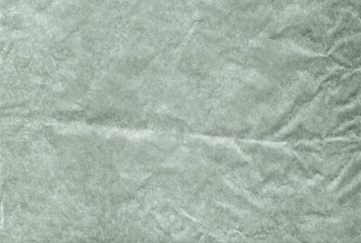 The Green blank crumpled and grungy textured paper background