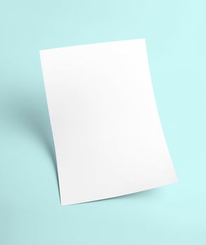 The white blank document paper template with blue background