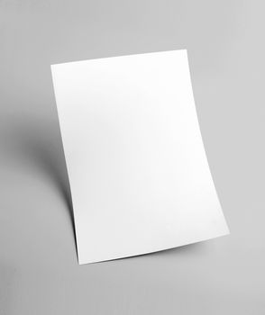 The white blank document paper template with grey background