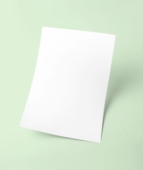 The white blank document paper template with green background