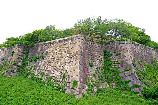 The Japan Osaka landmark historical castle architectural building with green plants