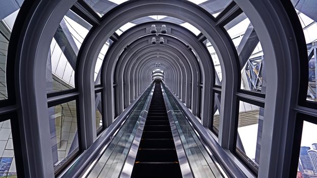 The indoor escalator, window, interior in architectural building from perspertive view