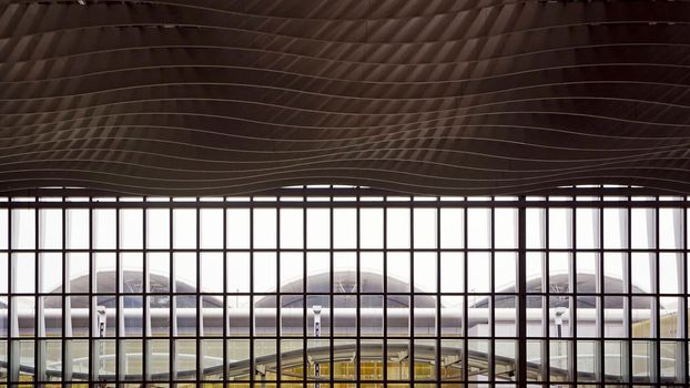 The window, interior and ceiling of airport archtecture terminal building