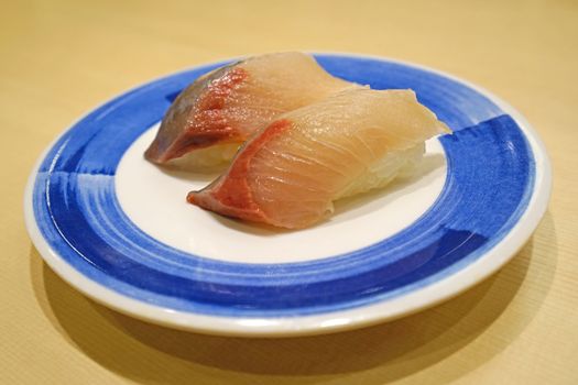 The KAMASU NIGIRI
 sushi on white dish in Japanese restuarant