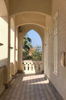 The exterior hallway of Christian church with sunlight and shadow