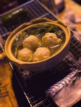 barbecue fishball bowl and fish on the metal net grilled