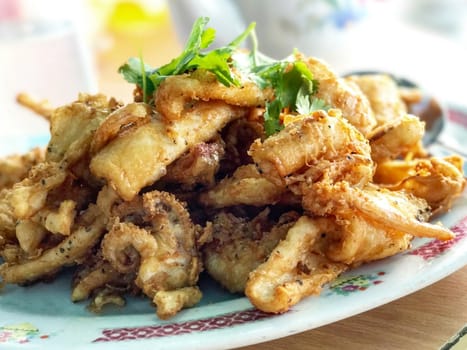 Indoor seafood squid on the white plate Chinese style