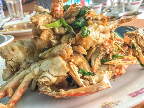 Indoor seafood crab on the white plate Chinese style