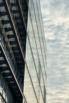 Commercial building with cloud reflection on the exterior glass window