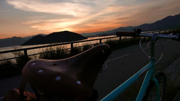 retro mint green bicycle with leather seat at the sunset