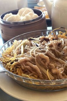 Traditional Chinese food, noodles, bread and the teapod