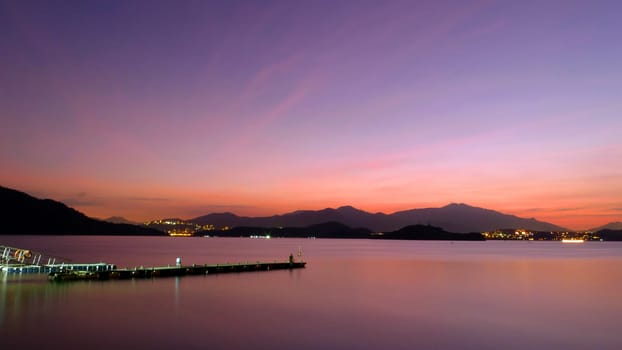 Romantic landsacape photo, lake , mountain and gradient sky at sunset