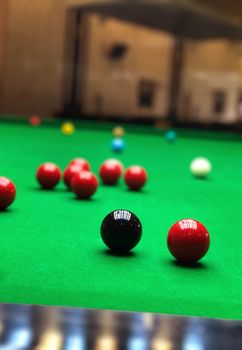 snooker balls on the green game table closeup