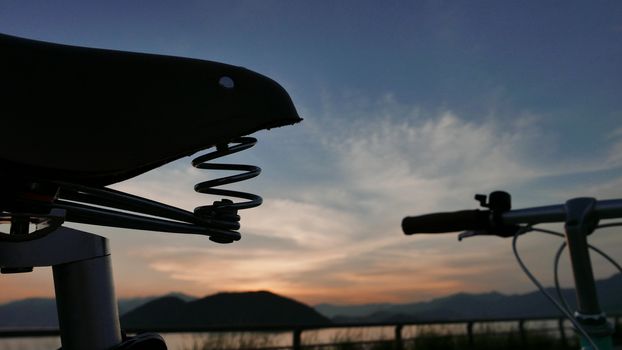 The silhouette of vintage bicycle and the sunset