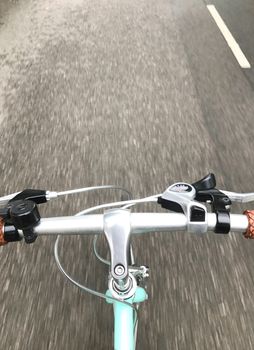 the head of mint green bicycle on the road