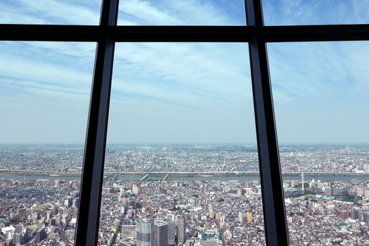 Cityscape, road, commercial and residential building from sightseeing tower in Japan