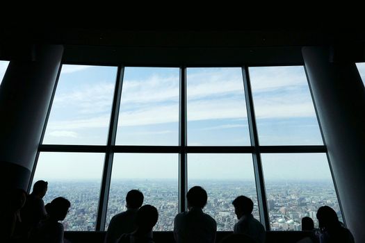 The silhouette of sightseeing people with Japan cityscape background