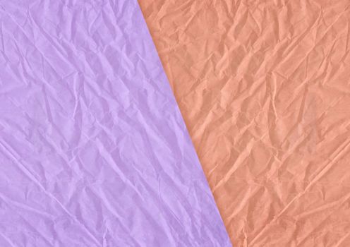 The orange, purple blank crumpled and grungy textured paper background