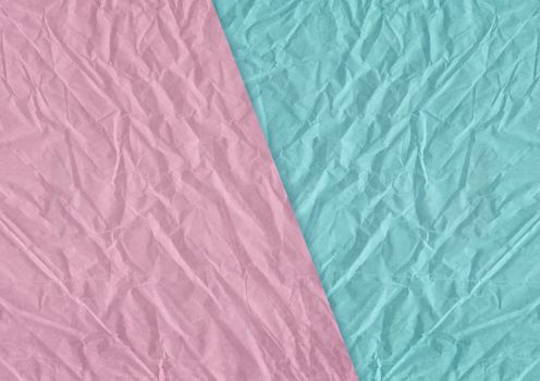 The pink, blue blank crumpled and grungy textured paper background
