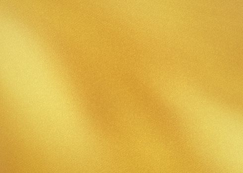 The golden shiny abstract metallic textured glass background