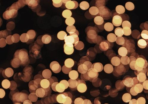 The golden bokeh glittering bright abstract background