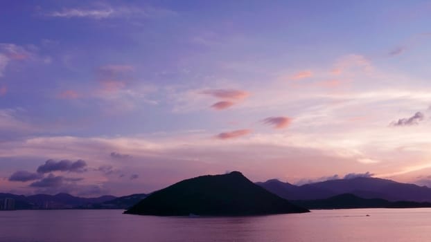 mountain, dramatic sky, boat on the sea at sunset