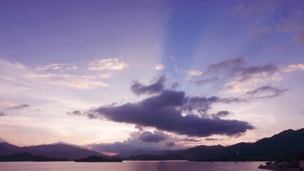 mountain, dramatic sky and sea at sunset