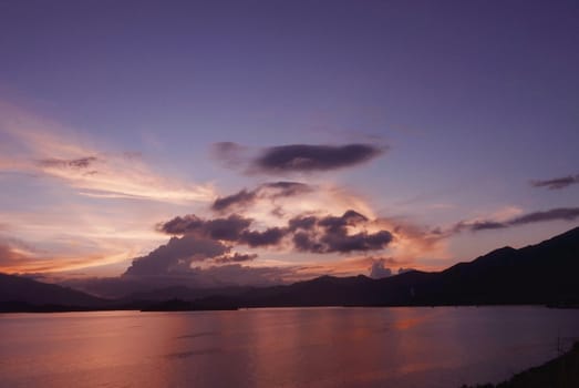 mountain, cloudscape, dramatic sky and the ocean at sunset