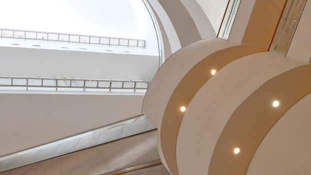 The indoor white wall and ceiling of the exhibition building