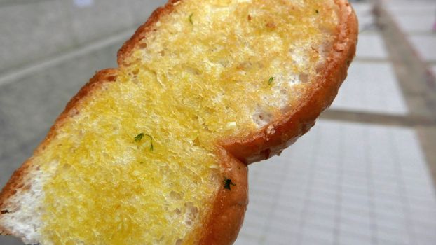 The barbeque outdoor butter garlic bread closeup