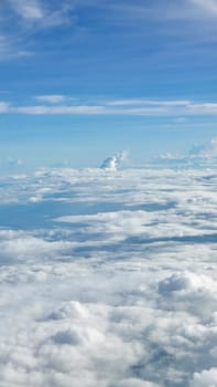 Vertical blue sky cloudscape background from the aerial view