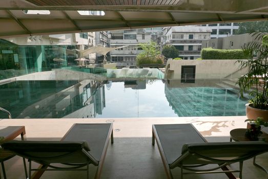 Swimming pool with reflection of the city