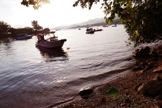 The Silhouette of fishing boat on the lake