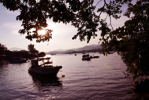 The Silhouette of fishing boat on the lake