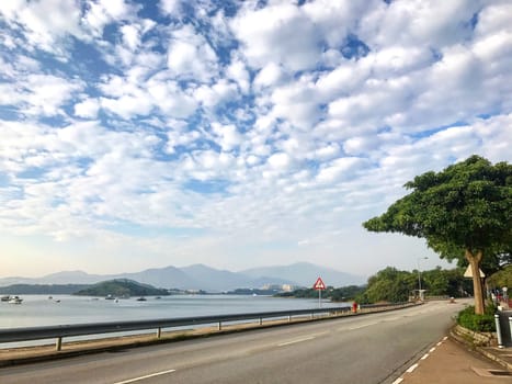 landscape photography - boat, lake, road with dramatric cloud