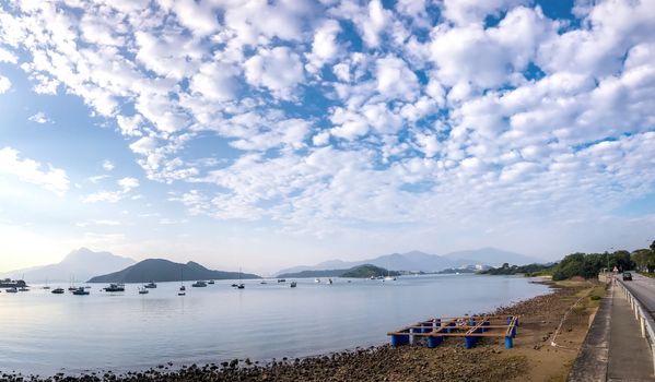 landscape photography - boat, lake, road with dramatric cloud