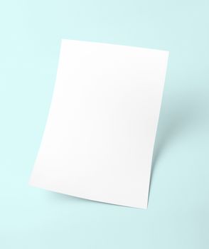 The white blank document paper template with blue background