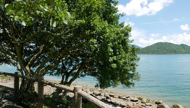 Outdoor wooden fence, mountain near the ocean