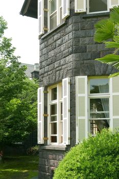 Townhouse in castle style with the window and backyard