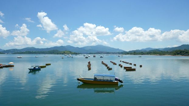 Recreational Boat, lake, white cloud and the blue sky