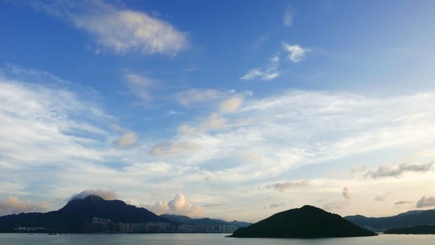 Residential building, mountain, white cloud and the Blue sky