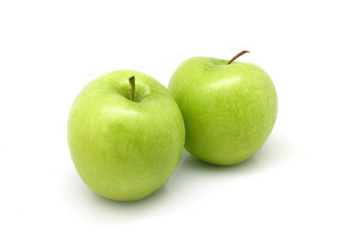 Two green apples on white background