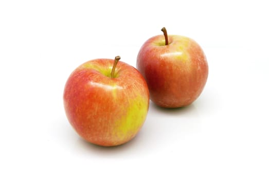 Two red apples on white background