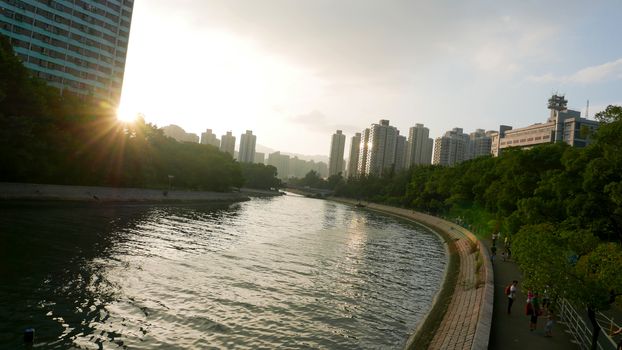 Residential buildings cityscape, cloudscape and river