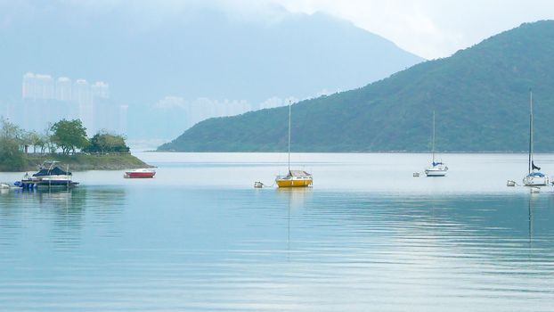 Boats, beautiful clouds, lake and blue sky