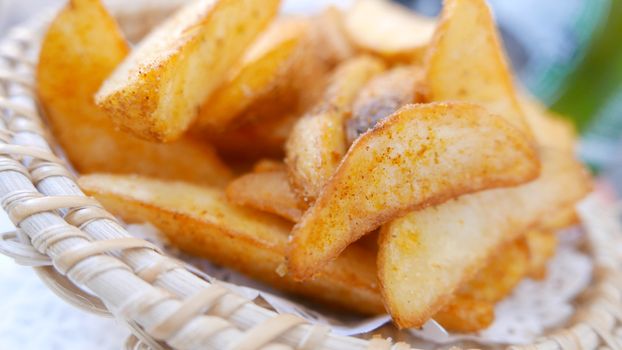 Potato fries on the light brown basket dish