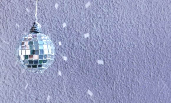 small decoration disco ball with reflection on the wall