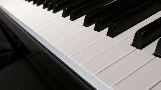 Keyboard of piano close-up, focus at the front